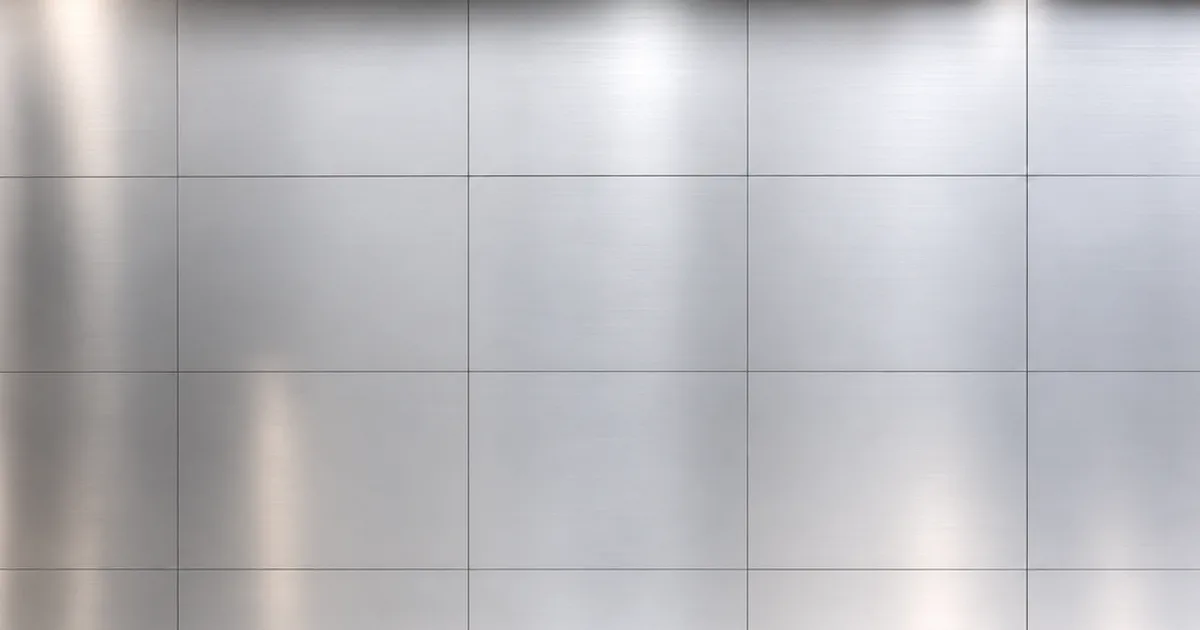 Photorealistic 3D render of a brushed metal panel surface tiled seamlessly across a large wall, reflecting soft studio light with subtle directional grain and no visible repeating marks