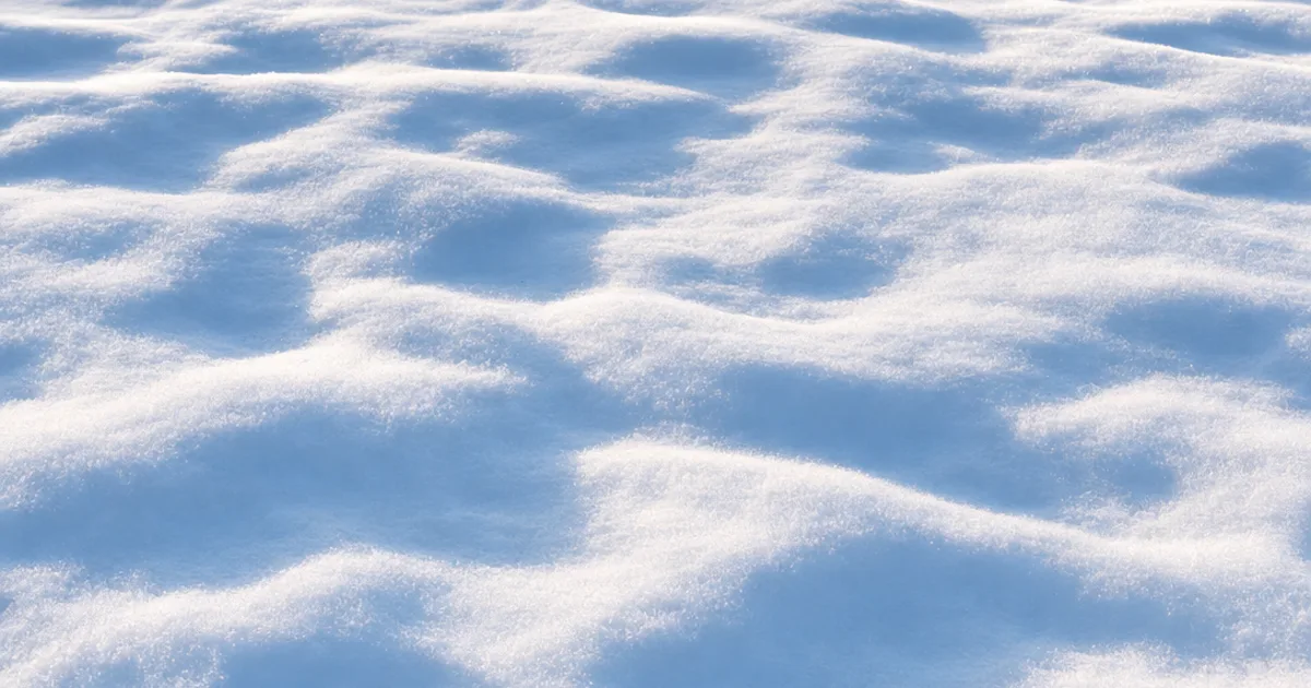 Photorealistic 3D render of fresh white snow with soft drifts tiled seamlessly across a winter landscape under cool blue low-angle light with no visible repeating pattern